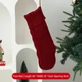 Large red knitted Christmas stocking with classic cable stitch design for holiday gifts - Cable Knit Christmas Stocking / Solid Red