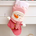 Pink plush Christmas stocking featuring a cute 3D snowman character decoration, 50cm height - Pink Snowman