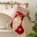 Large red Christmas stocking with 3D Santa Claus design and faux fur trim for holiday decor - Santa Claus