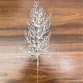 Close-up detail of a white artificial cedar branch for Christmas DIY decor on wood surface - Pine and Cypress Leaves / 35cm / White