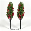 Close-up of two artificial Christmas garden stakes with pine needles and red berries - Green Pine Needle With Berries And Stake