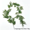 Macro view of realistic green artificial fern garland for Christmas home decoration - Willow Leaf Garland