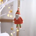 Handmade wool felt Christmas gnome ornament in red and green for festive holiday decor - Orange