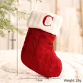 Festive red knitted Christmas stocking with white cuff and red letter C initial ornament - Letter C Style
