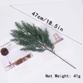 Close-up detail of realistic artificial green pine branch for Christmas decoration - Cypress Branch (47cm) / Green Cypress Leaf