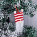 Decorative Christmas tree ornament featuring a red and white striped gnome with a long beard - Striped