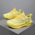 Professional yellow marathon running shoes with carbon plate and colorful splatter print - 35 / Golden Python