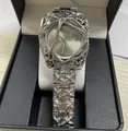 Reloj de aleación de metal líquido plateado con un diseño único de jaula esquelética - Banda Plateada Esfera Plateada