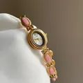 Montre-bracelet élégante vintage dorée pour femme avec pierres roses et mouvement quartz - Rose Avec Cadran Blanc Et Cadre Doré