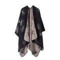Detail view of the reversible knitted shawl poncho featuring artistic ginkgo leaf patterns - Ginkgo / 160cm x 135cm / Navy Blue