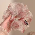 Elegant oversized Korean style scrunchie featuring a pink watercolor floral print design - Pink White