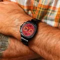 Close-up of a men's sports watch with a red dial and black stainless steel band - Round Dial / Black Red