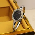 Elegante orologio a bracciale ovale argento con lunetta in strass e quadrante nero - Stile Ghiera con Strass Ovale / Stile Argento Nero con Strass