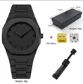 Montre à quartz minimaliste pour homme noir mat avec chiffres arabes - Avec Boîte Cadeau + Pile de Rechange + Outil de Montre / Échelle Noire (Ensemble)