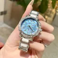 Montre NASIR luxe pour femme avec cadran en nacre bleue et lunette sertie de cristaux brillants - Bracelet en Céramique / Bleu