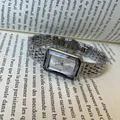 Elegant silver rectangular women's watch with metal link bracelet and Roman numerals. - Rectangular Faceted Mirror - Silver Metal Strap / Silver