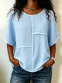 Close-up detail of light blue crinkled fabric patchwork top with round neck for women. - Sky Blue