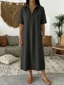 Casual charcoal gray linen maxi dress with Polo collar and short sleeves in a boho setting. - S / Dresses / Black