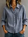 Close-up detail of blue and white checkered casual loose-fit button-down shirt for women - XS / Tops / Navy Blue