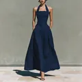 Elegant navy blue halter neck maxi dress with side pockets and a flattering slim fit profile. - Navy Blue