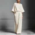 Elegante completo due pezzi in lino crema con top a maniche svasate e pantaloni - Taglia S / Parte Superiore e Parte Inferiore / Bianco latte
