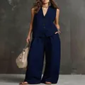Vista completa dell'elegante completo gilet in lino blu scuro e pantaloni larghi - XS / Top E Pantaloni / Blu scuro
