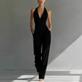 Elegantes französisches Set aus schwarzem Neckholder-Top und weit geschnittener High-Waist-Hose - S / Oberteil Und Unterteil / Schwarz