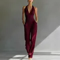 Elegante bordeauxrode set met haltertop en broek met hoge taille en wijde pijpen - Bordeauxrood