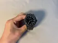 Millennium Y2K men's wrist watch featuring an irregular black case with calendar display - Black