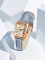 Close-up view of vintage rectangular rose gold women's watch featuring a blue leather strap - Sky Blue
