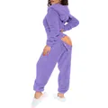 Detailed view of purple fuzzy hooded onesie featuring a functional buttoned butt flap. - Purple