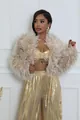 Detailed look at a chic beige faux fur short jacket paired with shiny gold metallic pants - S / Tops / Apricot