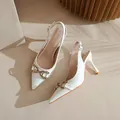 Elegant white patent leather pointed-toe slingback high heels with gold horsebit buckle - 34 / 7.5cm Off-white