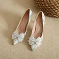 Elegant pointed-toe pumps in ivory fabric with sparkling rhinestone bow detail - 38 / 10cm Stiletto Heel / Blue