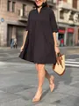 Style de rue d'une femme en robe chemise noire ample avec des manches de longueur moyenne. - S / Robe (Boutonnée) / Noir