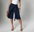 Close-up detail of navy blue wrap-style tie-waist culottes with elegant fashion draping - Navy Blue