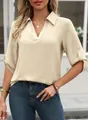 Close-up of stylish beige V-neck half-sleeve blouse with textured fabric - S / Khaki