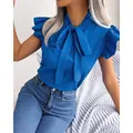 Elegant royal blue short sleeve blouse with a bow tie neck and stylish ruffled sleeves - S / Tops / Blue
