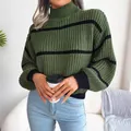 Detailed view of women's green and black striped mock neck sweater with lantern sleeves - One Size / Tops / Green