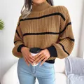 Detail of women's chunky knit striped sweater with mock neck and lantern sleeves - One Size / Tops / Khaki