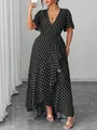 Detailed view of the ruffle hem and polka dot pattern of this plus size maxi dress. - 3XL / Dresses / Black