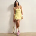 Full body view of a stylish yellow tennis dress with white spaghetti straps and contrast trim - S / Dresses / Lemon Yellow