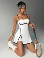 Detailed view of slim white tennis dress with black contrast piping and A-line skirt - S / Dresses / Ivory