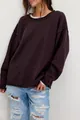 Stylish oversized dark purple crew neck knit sweater for women paired with ripped denim jeans - Burgundy