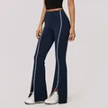 Navy blue high-waisted flared yoga pants with white piping and side slit detail. - S / Bottoms / Navy Blue