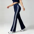 Navy blue high-waisted flared yoga pants with white side stripes for fitness workouts - S / Bottoms / Navy Blue
