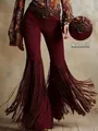 Detailed view of burgundy faux suede flare pants with western-style long fringes - S / Bottoms / Burgundy