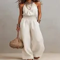 Elegant sleeveless linen jumpsuit featuring a backless design and wide-leg style - S / Jumpsuits / White