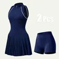 Two-piece women's navy blue pleated tennis dress set with sleeveless mock neck and shorts - XS / Top And Bottom / Navy Blue