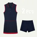 Ensemble robe de tennis polo sans manches bleu marine et short de sport à liseré rouge - XS / Ensemble / Bleu marine